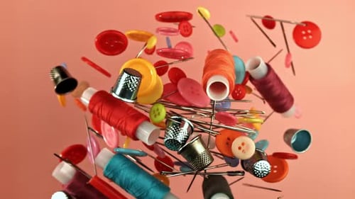 Sewing Notions Floating Mid-Air on Pink Background