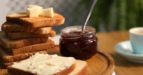 Toast with butter and jam breakfast close up
