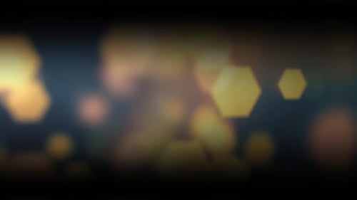 Abstract Background with Yellow Blurry Hexagonal Bokeh Darkening Edges
