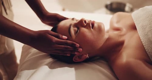 Woman Receiving a Relaxing Facial Massage Treatment