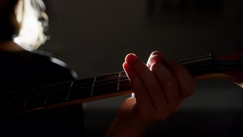 Hand Playing Guitar Chords