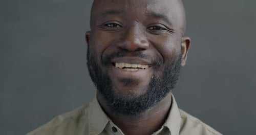 Man Smiling in Close Up Portrait