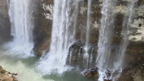 Scenic Waterfall Cascading in Natural Environment