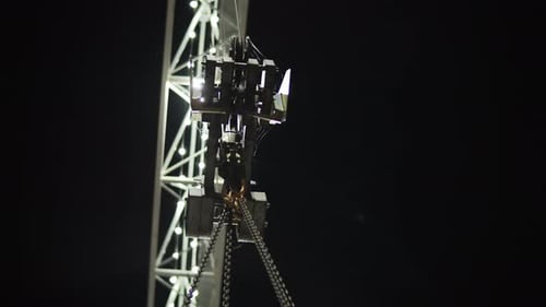 Construction Crane Hook and Chains at Night