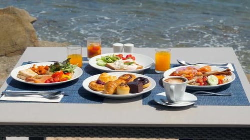 Luxury Breakfast Spread on Table with a Stunning Tropical Sea View