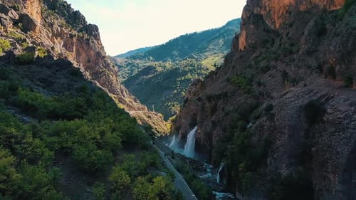 Span Between Mountain Cliffs View of Beautiful Waterfalls