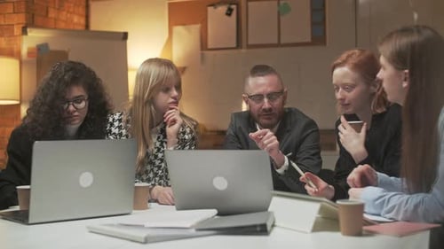 Diverse Business Team Discussing Project Strategy in Office Meeting