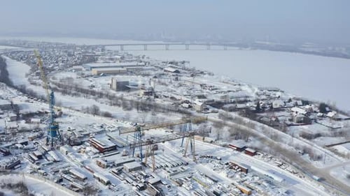 Aerial view of a snow covered industrial zone of the city