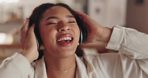 Happy Woman Listening To Music With Headphones