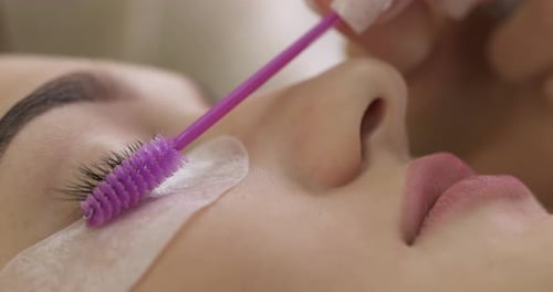 Eyelash Extension Treatment with Purple Brush