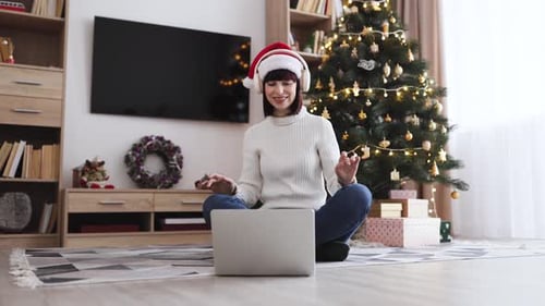 Woman on Video Call Wearing Santa Hat at Christmas