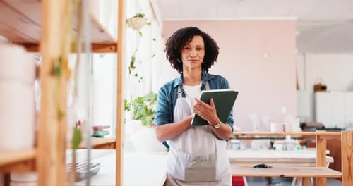 Woman, face and tablet in workshop for pottery, inventory management and clay order
