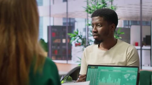 Professional Businesswoman Reviews Resume of a Job Candidate During Interview