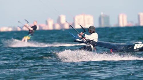 Sportsman practicing kite surf sport at the beach on a windy day at the Spanish coasts