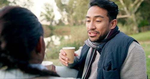 Man and Woman Chatting Over Coffee Outdoors