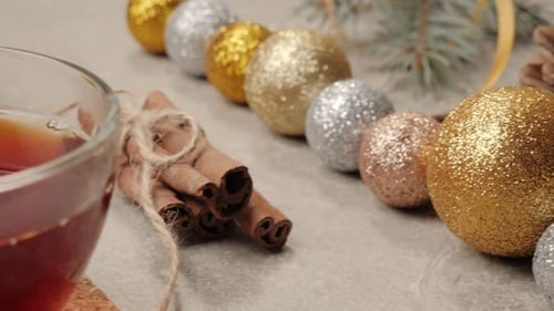 Close Up of Christmas Decoration with Tea and Cinnamon