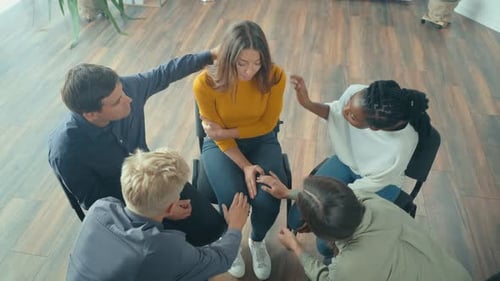 View From Above A Group of People Sitting in a Circle During a Group Therapy