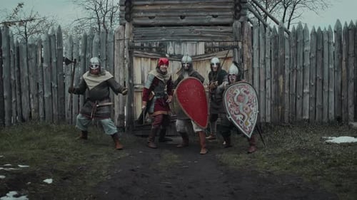 Figures in Medieval Attire Run from Fort