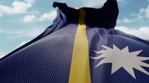Realistic Nauru Flag Waving in Slow Motion against Blue Sky