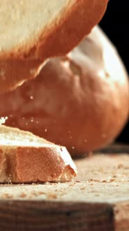 Sliced Bread Falls Onto a Cutting Board Filmed on a Highspeed Camera at 1000 Fps