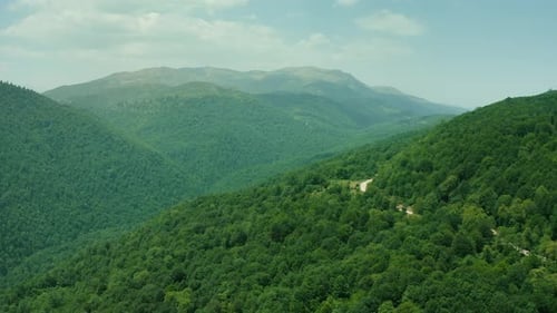 Cinematic Drone Shot of a Lush Green Valley and Remote Village – 4K