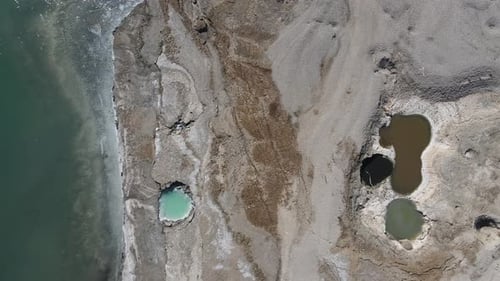 Top aerial view of pools between rocks in the Dead Sea, Israel