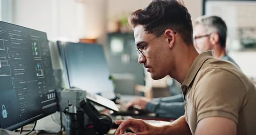 Man, office and happy with coding on computer for programing and system update as software engineer