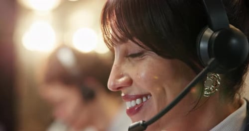 Happy woman, agent or night with headset for customer service or online advice in call center