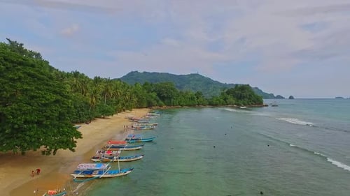 Trenggalek, 05 April 2016, Aerial view of the beach with a tour boat