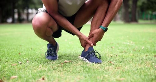 Man, athlete and leg injury on sport field for body workout with hands and anatomy outside