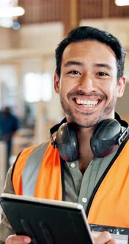 Construction, tablet and face of man in workshop for building project, renovation and maintenance