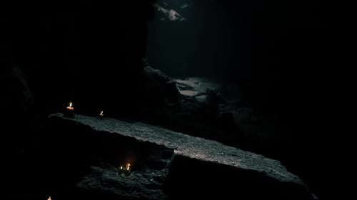 Mysterious Underground Cave Illuminated By Flickering Candles at Night