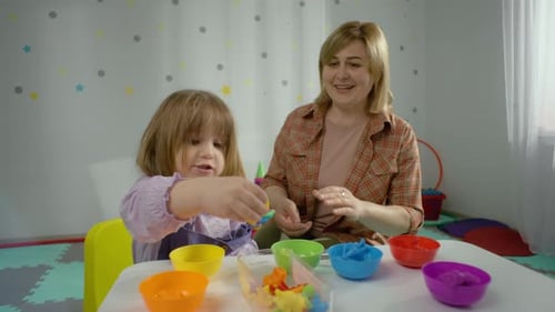 Captivating Footage of a Child and Teacher Playing Developmental Games