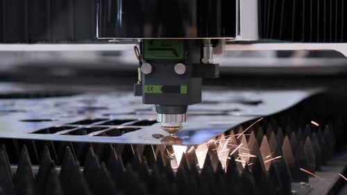 Precision laser cutting sparks fly in automated steel fabrication process