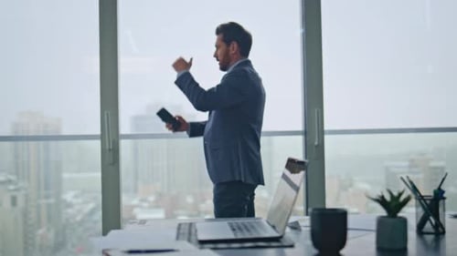 Irritated Boss Calling Smartphone Feeling Stress at Panoramic Windows Office