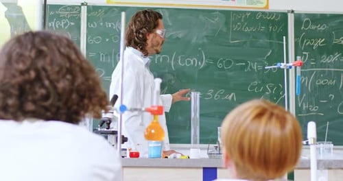Teacher Demonstrates Science Experiment to Students in Classroom
