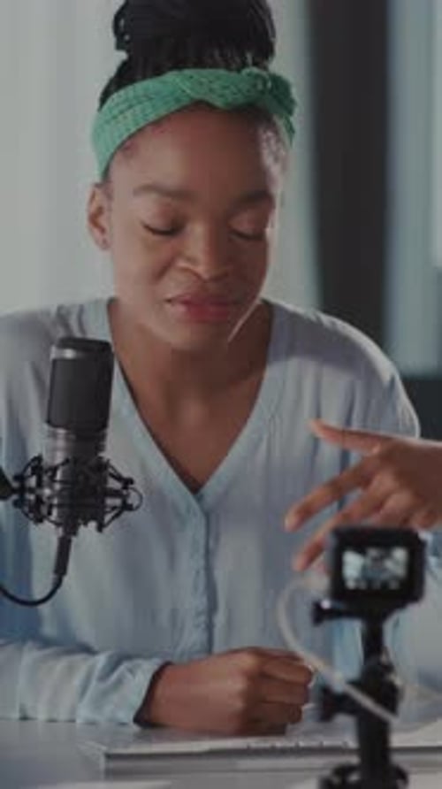 Podcaster Recording Setup Professional Home Studio Environment with Focused Presenter and Camera