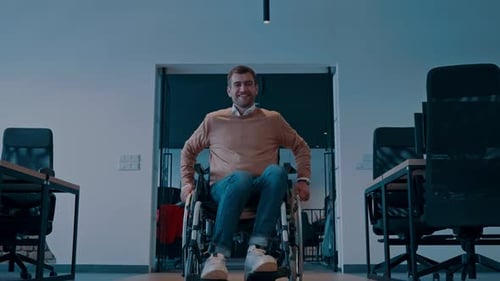 Modern Startup Coworking Office Corridor with Glass Walls Featuring a Businessman with Disabilities