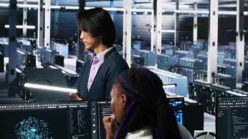 Software Developers Cooperating in Data Center Reviewing AI Diagnostics