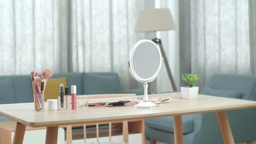 A Vanity With Many Cosmetics And Mirror Is In A Room At Home