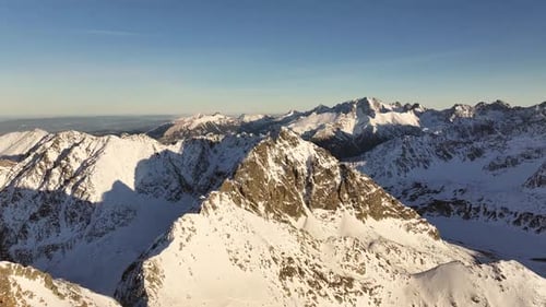 Stunning aerial view of the majestic Alps showcasing snow-capped peaks
