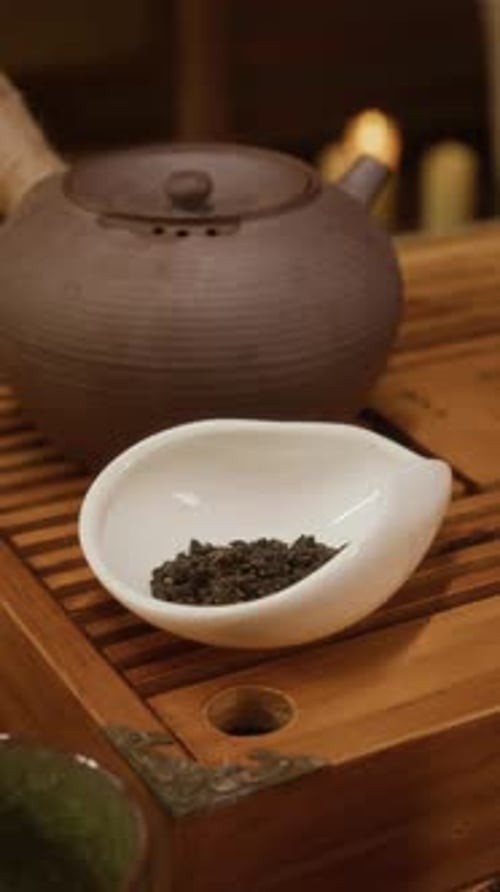 Vertical of Serving of Oolong Tea and Teapot on Gongfu Ceremony Tray