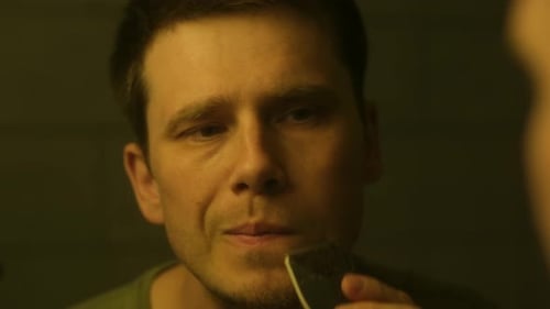 Man Trimming Mustache with Electric Trimmer Close-Up