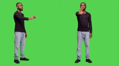 Man on green screen gesturing stop hand sign