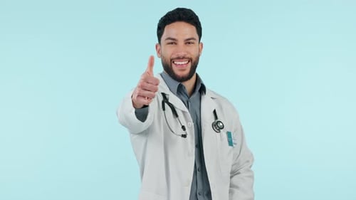 Man, doctor and thumbs up, success or healthcare support, thank you and like emoji in studio