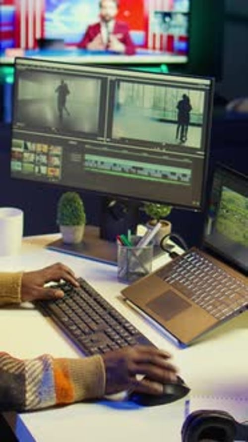 Woman Video Editing at Computer in Office