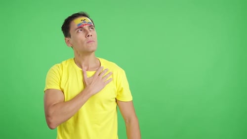 Man Listening to the Ecuador National Anthem with Solemnity