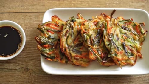 Korean Vegetable Pancakes with Sauce on Plate
