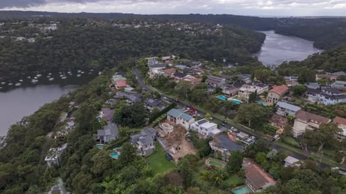 Aerial hyperlapse of crane operating on a house in suburban sydney