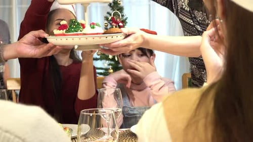 Family Celebrates Christmas with Festive Cupcakes